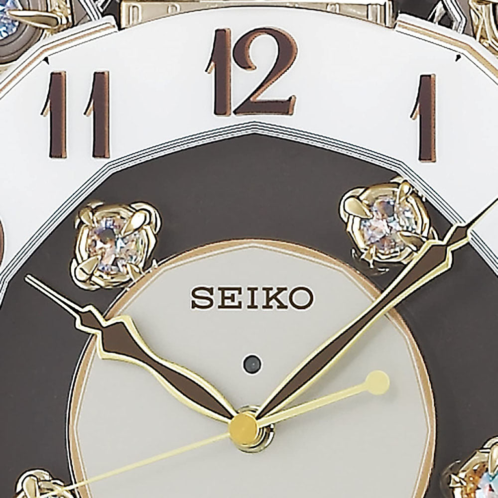 [SEIKO] セイコー クロック 掛時計 からくり 40曲 メロディ 回転飾り RE578B ＜ 薄金色 パール 電波時計 アナログ ＞